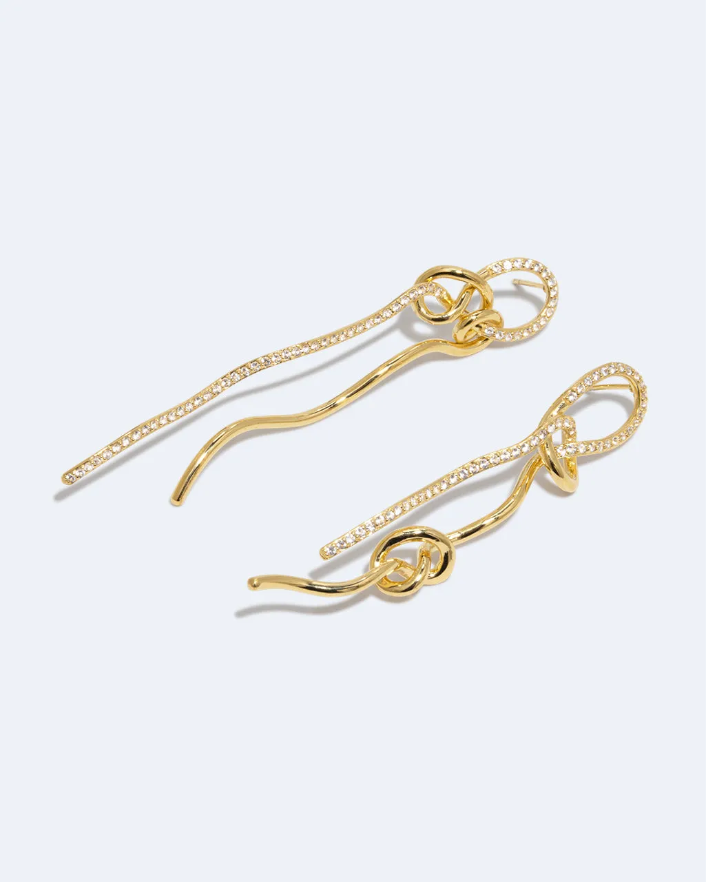 Completedworks Coil Not Even The Mathematician Can Create Things At Will boucles d’oreilles topaze blanche