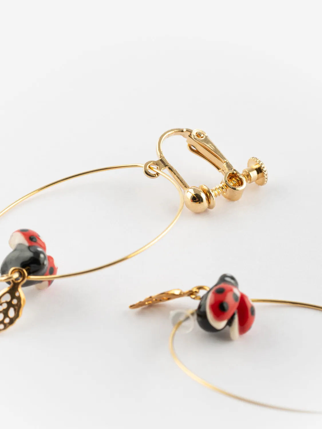 Nach Bijoux feuille coccinelle boucles d'oreilles créoles clip porcelaine