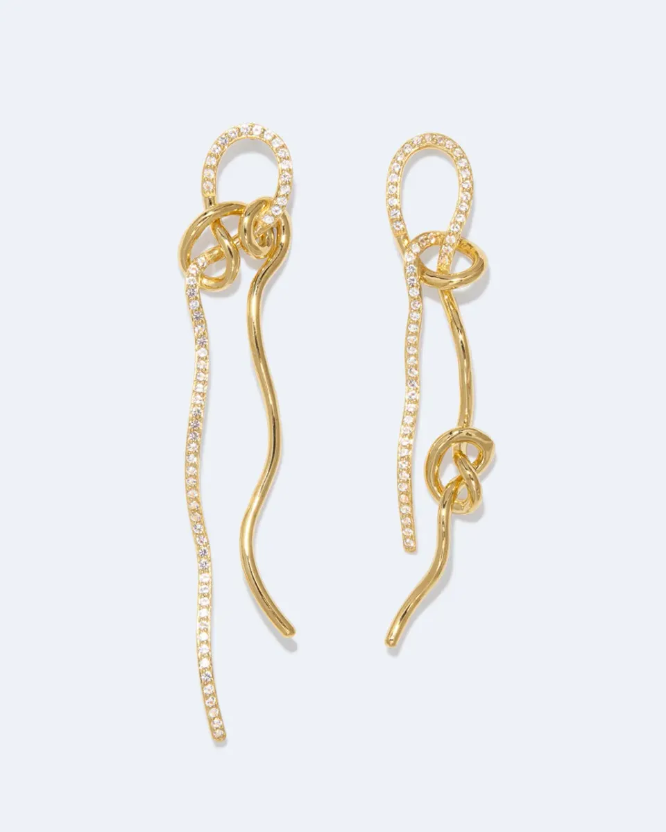 Completedworks Coil Not Even The Mathematician Can Create Things At Will boucles d’oreilles topaze blanche