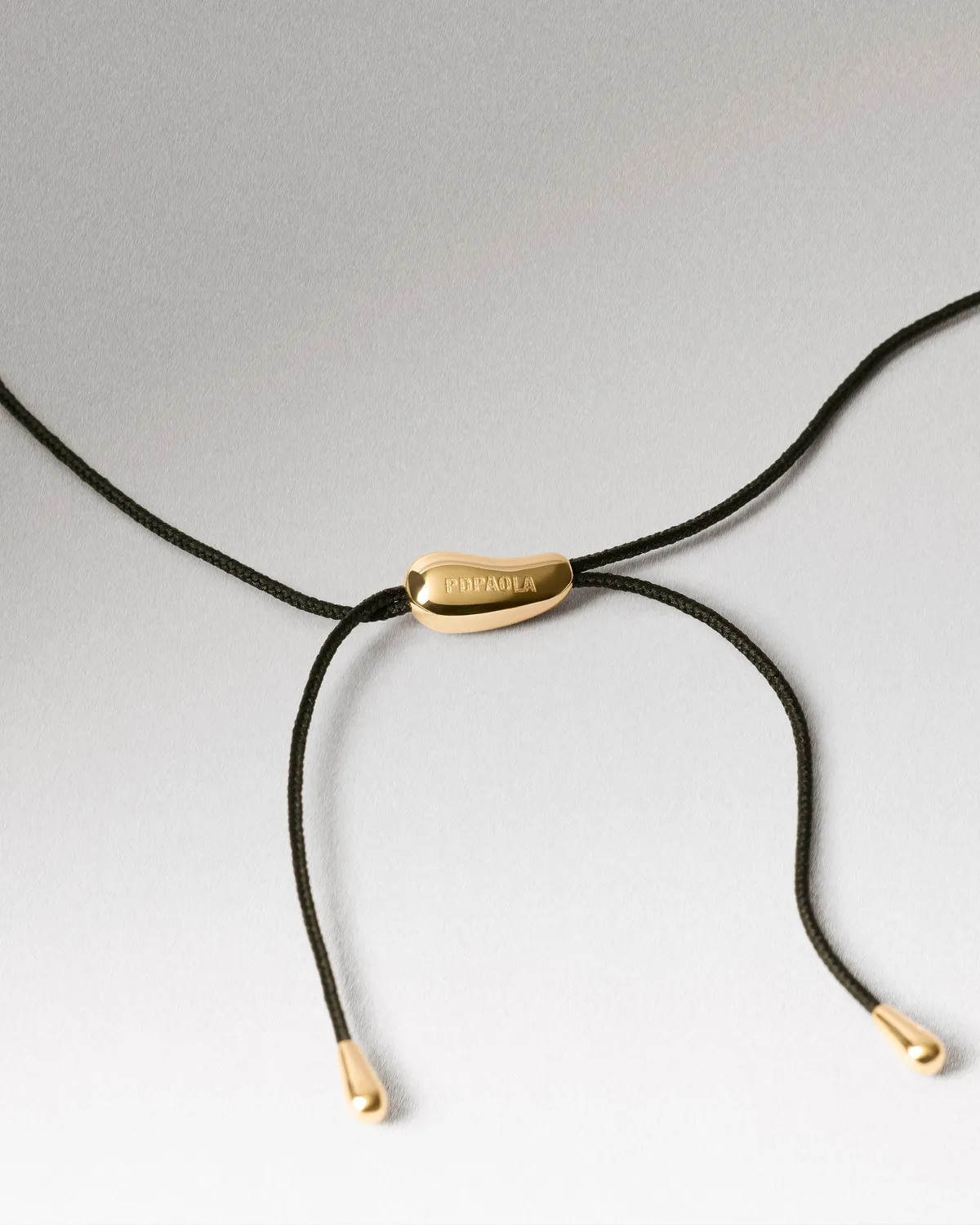 PDPAOLA Rodeo collier cordon noir motif doré