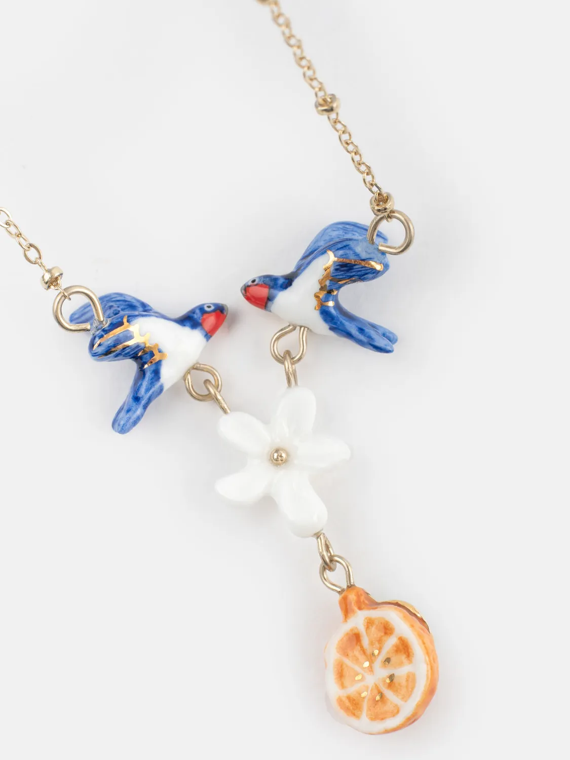 Nach Bijoux hirondelles fleur orange collier porcelaine