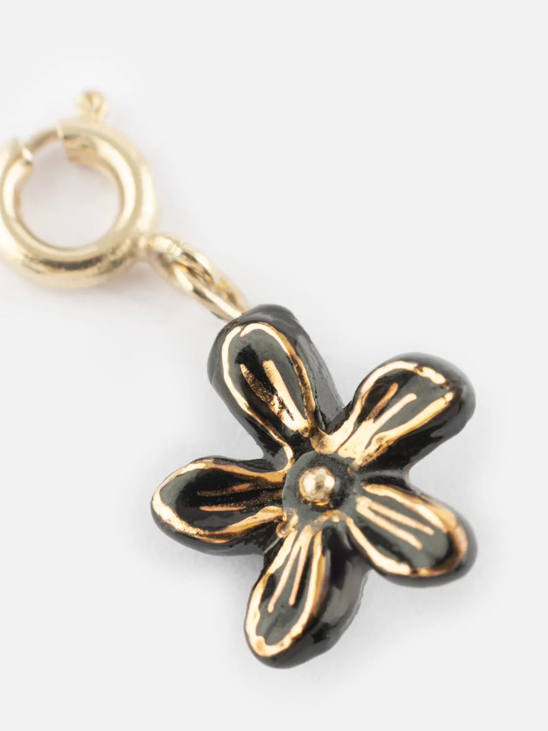 Nach Bijoux Charm fleur d'Erine noire porcelaine dorée