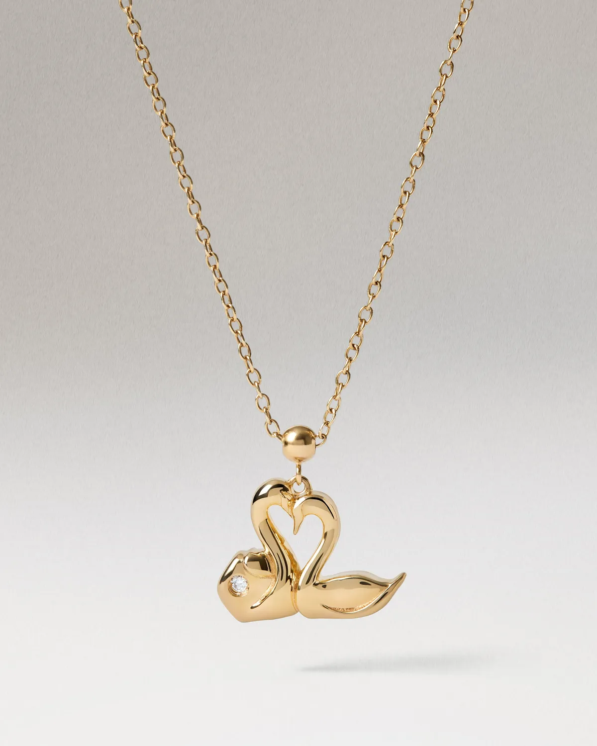 PDPAOLA Love Swans charm doré zirconia blanche