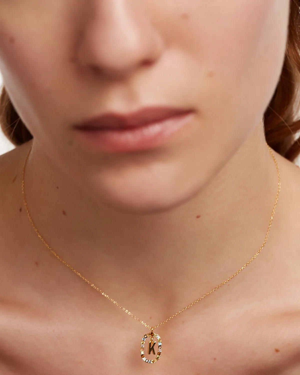 PDPAOLA Lettre K collier plaqué or pierres