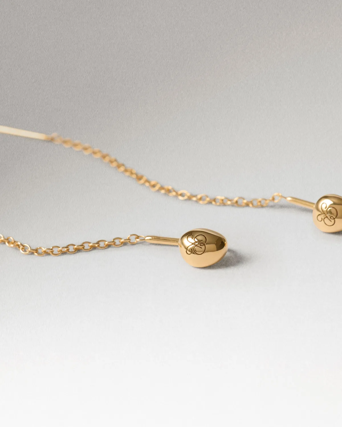 PDPAOLA Lyra boucles d'oreilles dorées longues