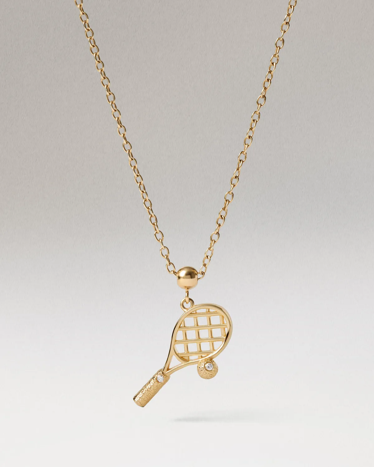 PDPAOLA Charms breloque tennis dorée zirconia blanche