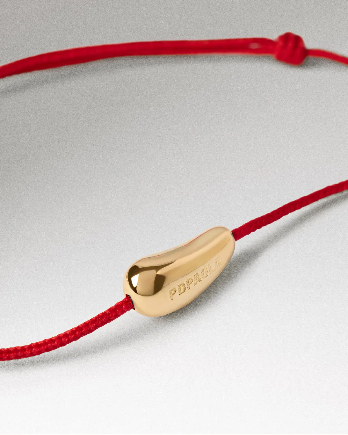 PDPAOLA Rodeo bracelet cordon rouge doré