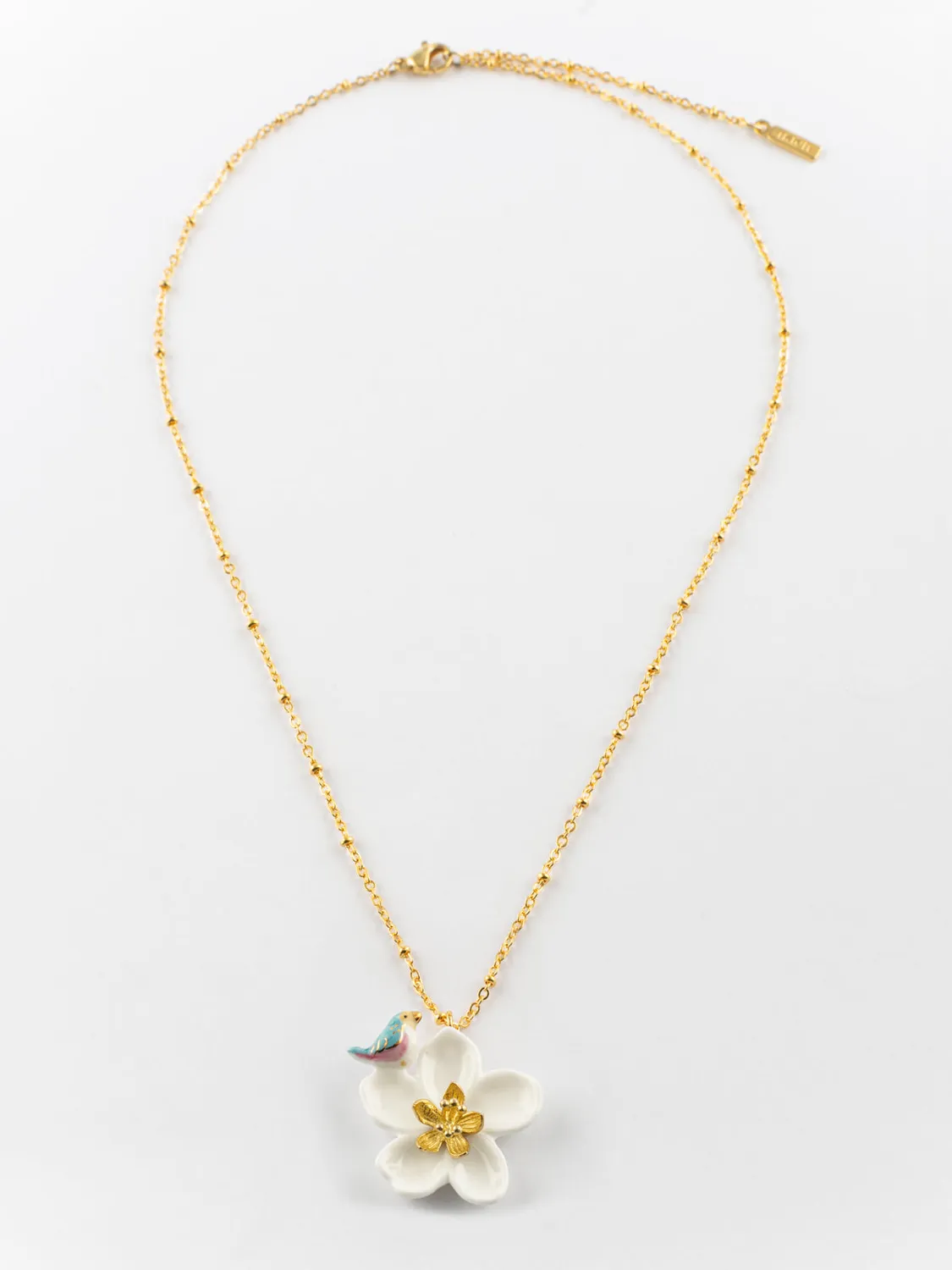 Nach Bijoux fleur de poirier et oiseau collier porcelaine