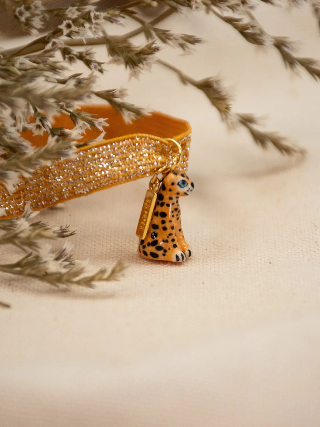 Nach Bijoux twistband léopard bracelet élastique doré