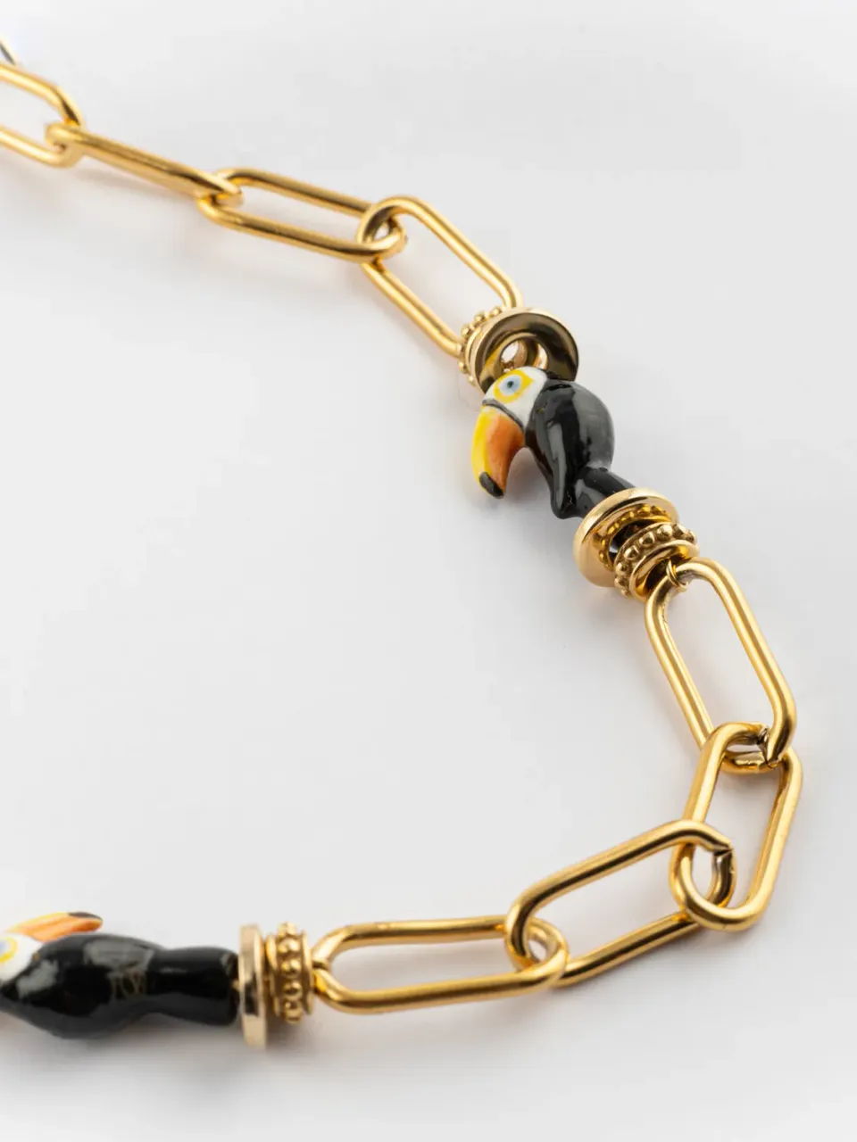 Nach Bijoux chaîne toucan collier porcelaine dorée