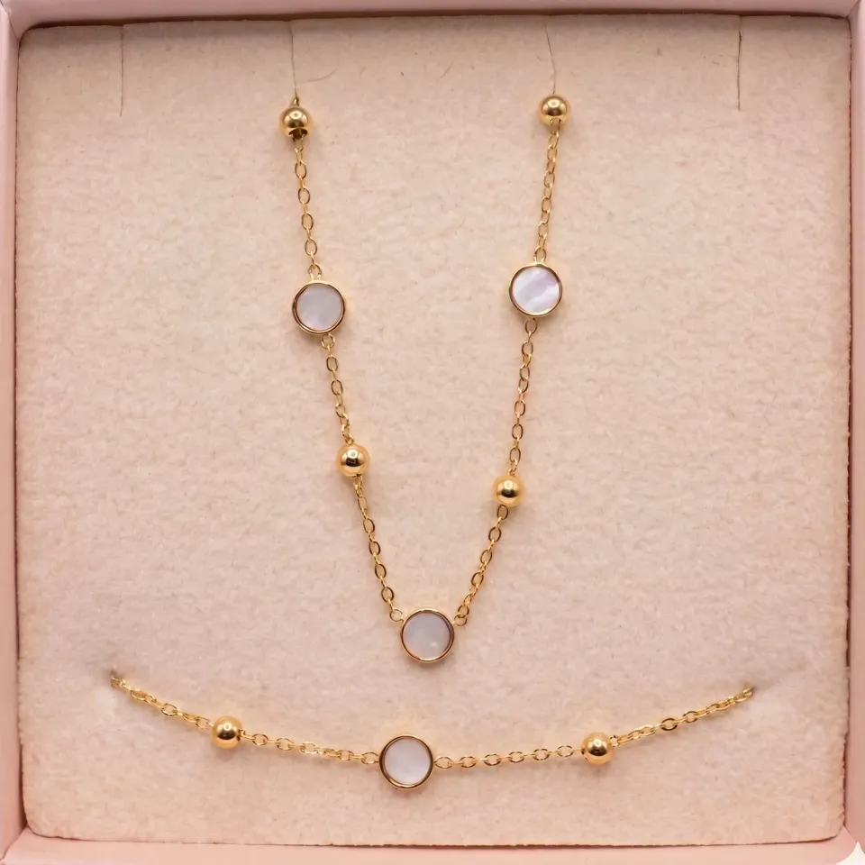 Nao de Paris Mini Nacre coffret collier bracelet doré