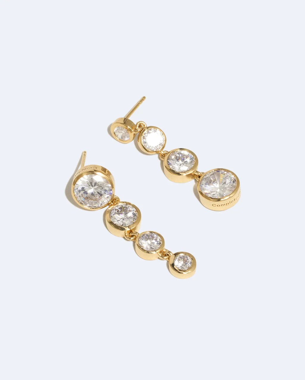 Completedworks Light of the Past II boucles d'oreilles zircone doré