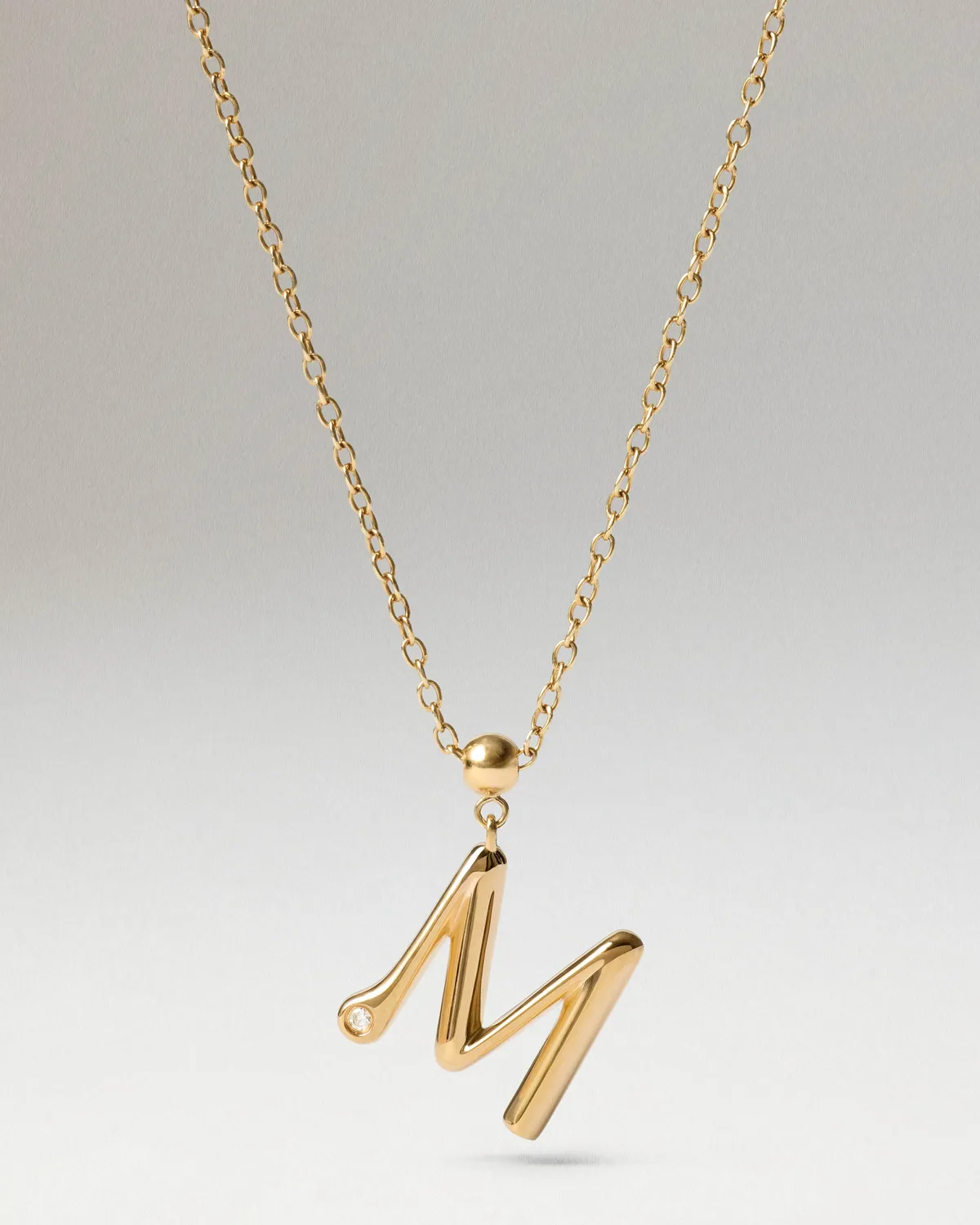 PDPAOLA Initial M charm doré zirconia